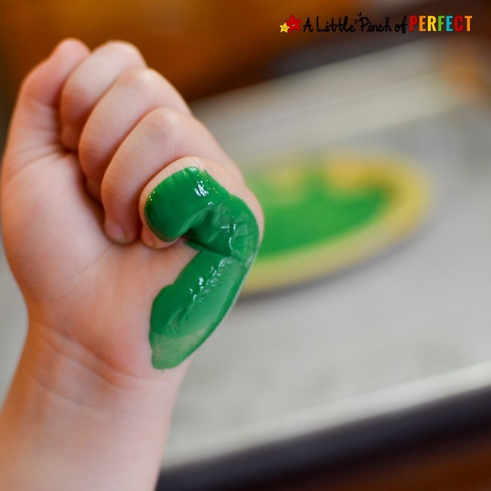 Kids can make wee little Leprechaun tracks as they craft this St. Patrick's Day using their hands as a footprint stamp. (March, Kindergarten, Preschool, Handprints)