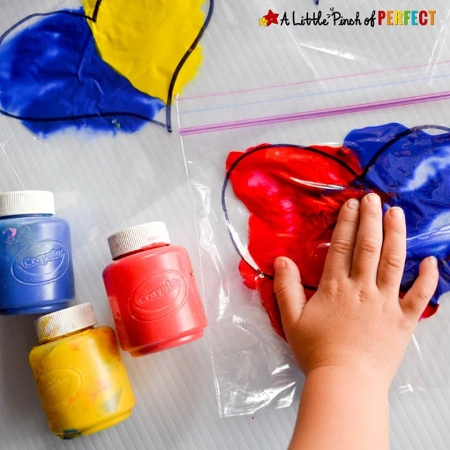 Mix ‘n Squish Hearts: Valentine’s Day Sensory Bags to Explore Color