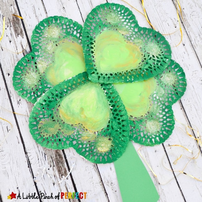 Lovely St. Patrickâs Day Shamrock Craft for Kids: Easy to make four leaf clover craft with doilies or paper hearts
