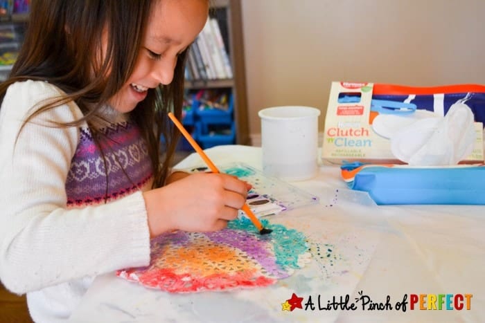 Beautiful Easter Egg Doily Craft for Kids Inspired by Rechenka's Eggs: An easy step-by-step tutorial showing how kids can make Easter Eggs that look intricately decorated like the ones straight out of Patricia Polacco&rsquo;s book. 