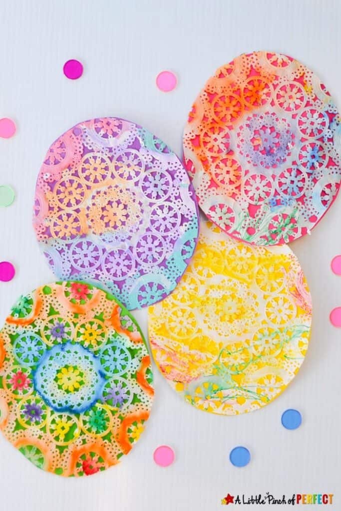 Beautiful Easter Egg Doily Craft for Kids Inspired by Rechenka's Eggs: An easy step-by-step tutorial showing how kids can make Easter Eggs that look intricately decorated like the ones straight out of Patricia Polacco&rsquo;s book. 
