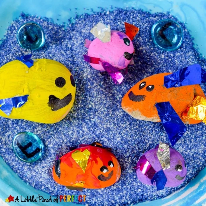 Painted Rock Fish Craft and Play Idea for Kids: Once kids are done crafting they can play with their cute fish craft in a sensory bin, garden, or pool of water. (ocean theme, summer, kids craft)