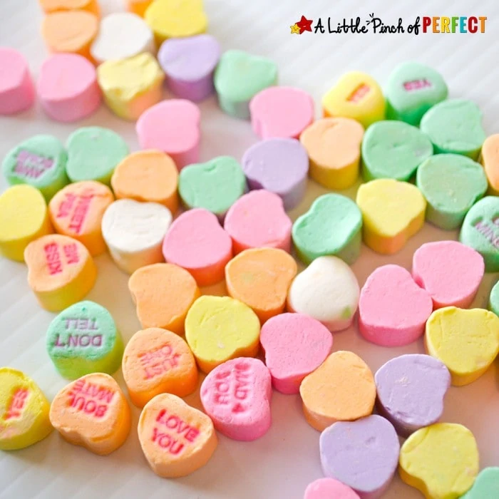 Candy Heart Sort and Graph Valentine's Day Math with Free Printable: Kids can use conversation hearts and hands on manipulates during this sweet math time activity. Two free printable graphs to choose from to make sure the colors on the graph match your box of candy. (February, Preschool, Kindergarten, First Grade)