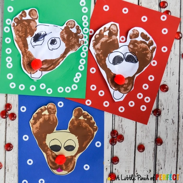 Make a darling footprint Rudolf the Red Nose Reindeer craft with kids this Christmas. They are so easy to make and are certainly cute. #christmas #crafts #preschool #rudolf