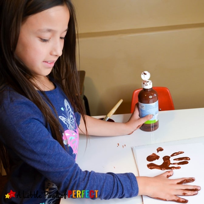 Make a Handprint Rudolph craft for Christmas with our free craft template and your child's hands. You can paint their hand or trace it out and top it off with the template for an easy Christmas craft. (#christmas #christmascraft #kidscraft #kidsactivity #rudolph)