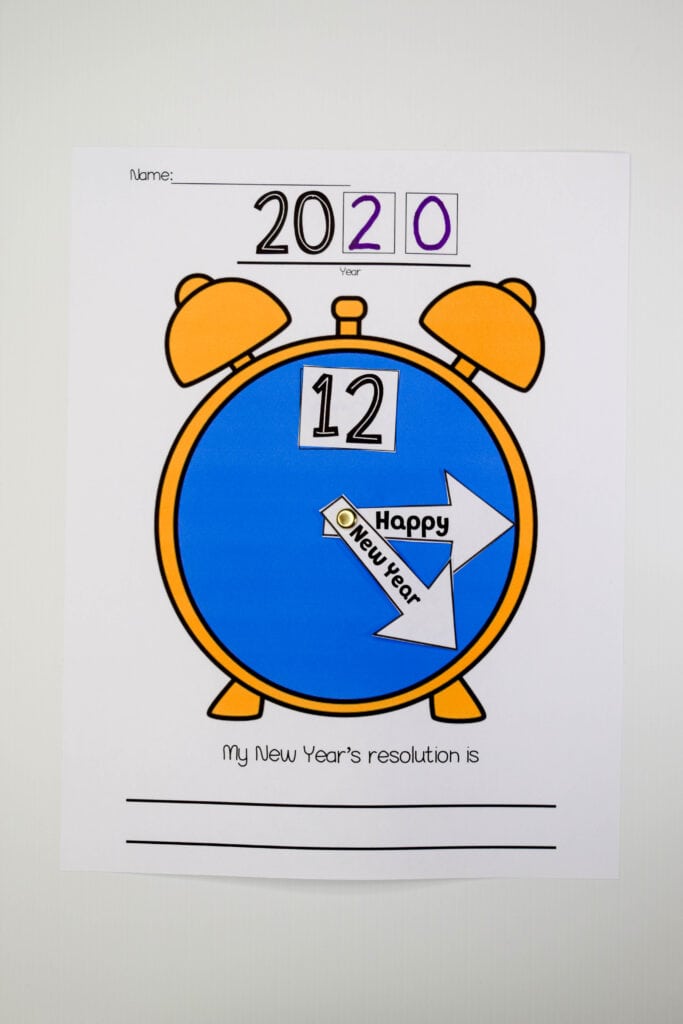 Kids will enjoy making their own New Near's clock to celebrate New Year's. Simply print the template and let them cut, assemble, and write their New Year's Resolution. The clock hands say "Happy New Year" and can be glued down or with the addition of a Metal Brad Fasteners-affiliate link, they can spin like a real clock. (#newyears #happynewyears #kidscraft #craft #newyearscraft #kidsactivity)