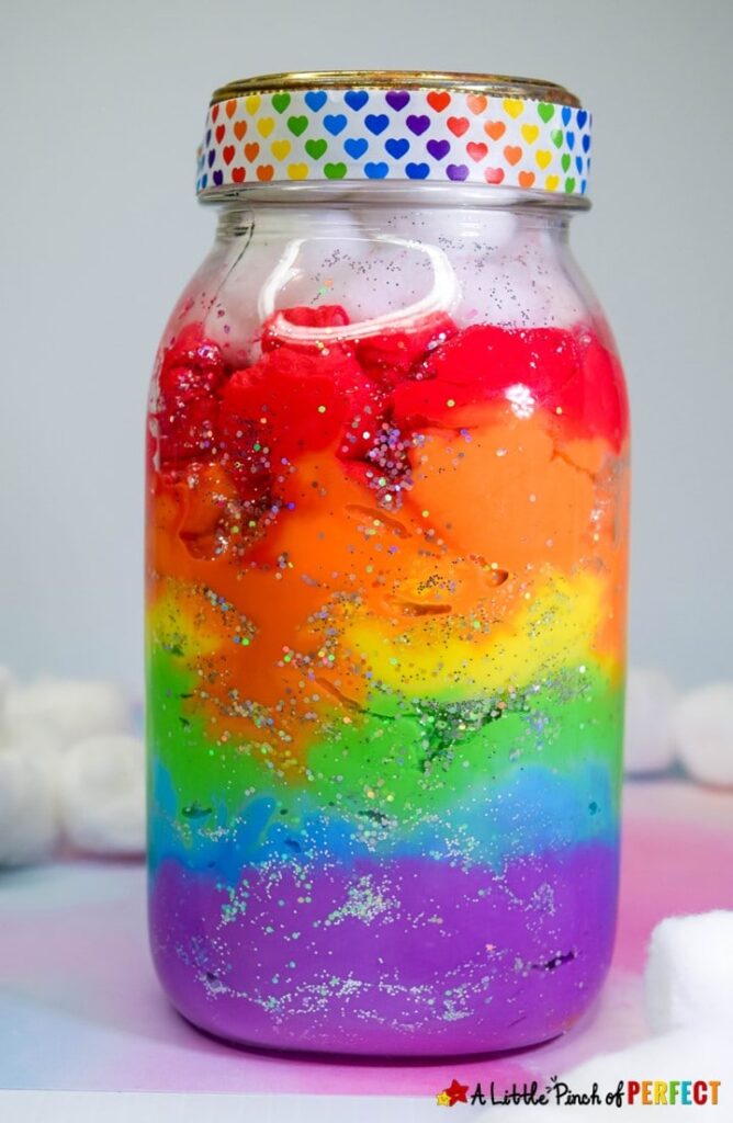 Follow these easy directions to make a Rainbow Jar with kids or anyone who loves rainbows (teens, and adults included). The rainbow jars look beautiful. This craft is perfect for spring, including in a science weather unit, learning about absorption, or having some St. Patrick's Day fun. (#kidscraft #kidsactivity #craft #masonjar #stpatricksday)
