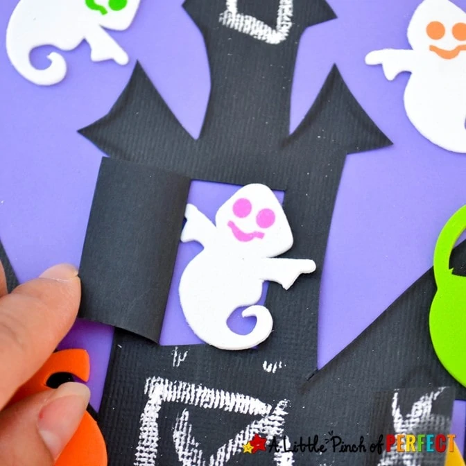 Make a spooky Haunted House craft with windows and doors that open and shut for Halloween friends to peek out of with our free craft template for kids. #craft #kidscraft #halloween #halloweencraft #crafttemplate