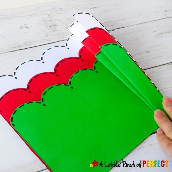 Paper Accordion Christmas Tree and Free Template for Kids: Kids can make a pretty folded paper Christmas Tree craft with our easy step-by-step directions and free template. (#christmas #kidscraft #craft #papercraft #christmastree #kidsactivity)