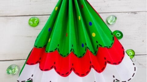 Paper Accordion Christmas Tree and Free Template for Kids: Kids can make a pretty folded paper Christmas Tree craft with our easy step-by-step directions and free template. (#christmas #kidscraft #craft #papercraft #christmastree #kidsactivity)