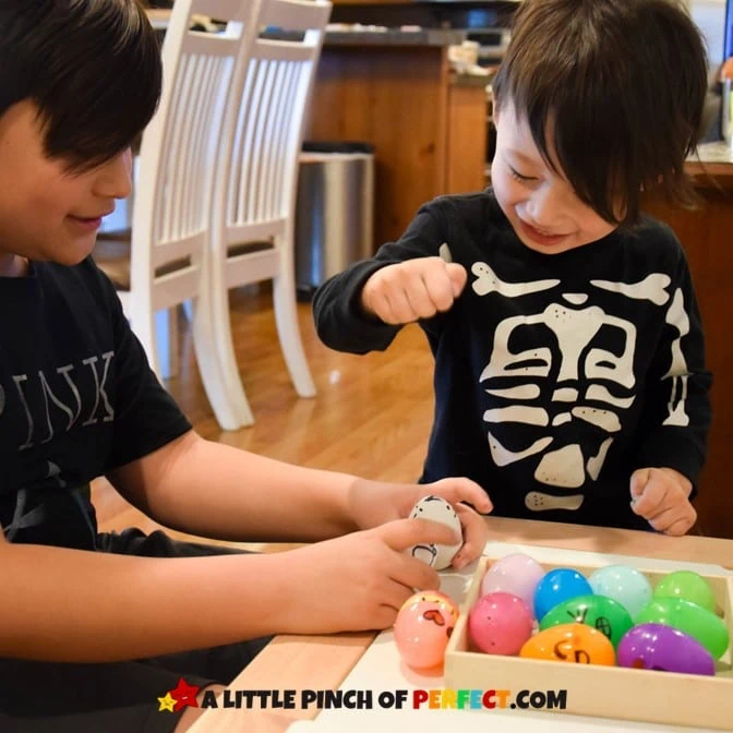 Boys playing with Egg Emotions Activity #preschool #socialemotional #kidsactivity 