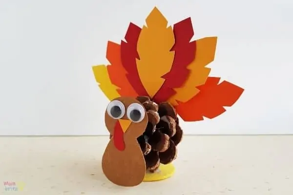 Pinecone Turkey Craft and more ideas for kids to make this Thanksgiving.  #thanksgivingcraft #kidscraft #kidsactivity