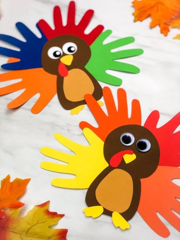 Handprint Turkey Paper Craft and more ideas for kids to make this Thanksgiving.  #thanksgivingcraft #kidscraft #kidsactivity