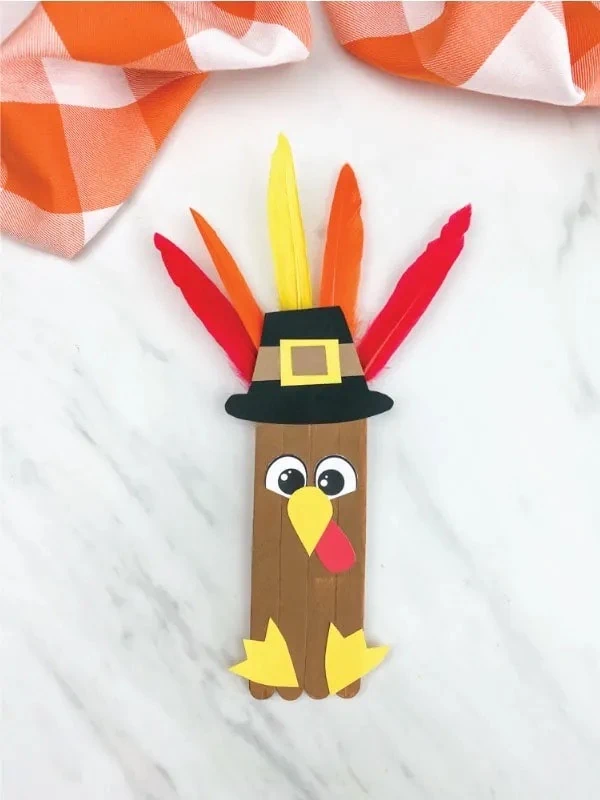 Popsicle Stick Turkey Craft and more ideas for kids to make this Thanksgiving.  #thanksgivingcraft #kidscraft #kidsactivity
