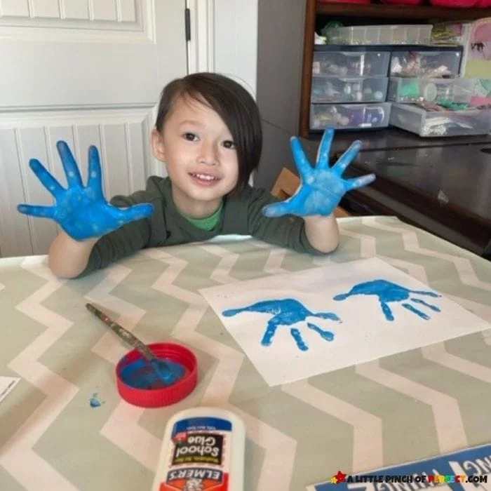Make a Thing 1 and Thing 2 handprint craft inspired by Dr. Seuss and the Cat in the Hat. Grab the free template and directions to make this EASY and CUTE craft. #kidsactivity #craft #preschool