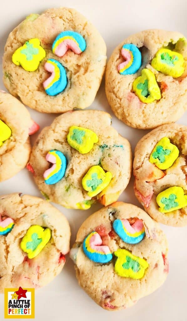 Celebrate St. Patrick's Day with these delicious Lucky Charms cookies. A magical treat filled with rainbows and clovers that the whole family will love! #recipe #cookie #luckycharms #stpatricksday