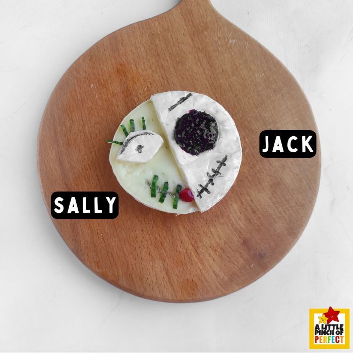 This Jack and Sally Halloween Charcuterie Board is the perfect spooky snacks for your Halloween party or movie night with the family. #halloween #nightmarebeforechristmas