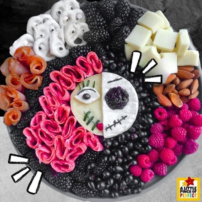 This Jack and Sally Halloween Charcuterie Board is the perfect spooky snacks for your Halloween party or movie night with the family. #halloween #nightmarebeforechristmas