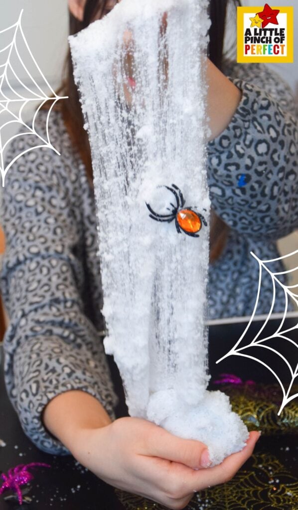 Learn how to make the spookiest spiderweb slime recipe for kids! This easy Halloween slime uses Insta Snow for a stretchy web effect and is extra fun with toy spiders.