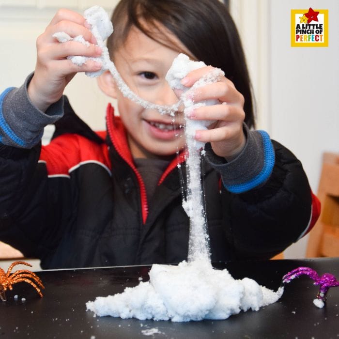 Learn how to make the spookiest spiderweb slime recipe for kids! This easy Halloween slime uses Insta Snow for a stretchy web effect and is extra fun with toy spiders.