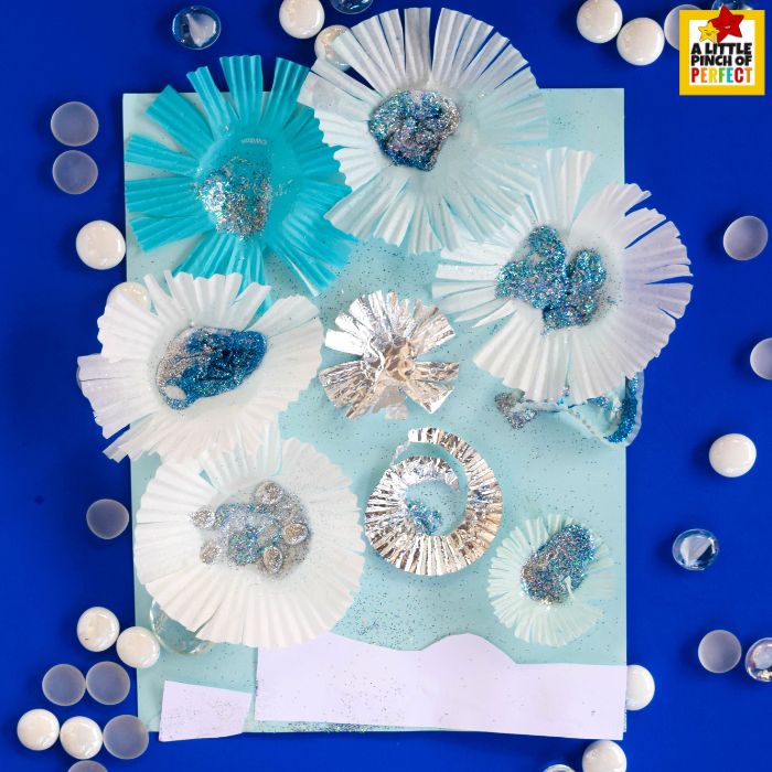Snowflake Craft for Kids: Colorful winter snowflake made from cupcake liners