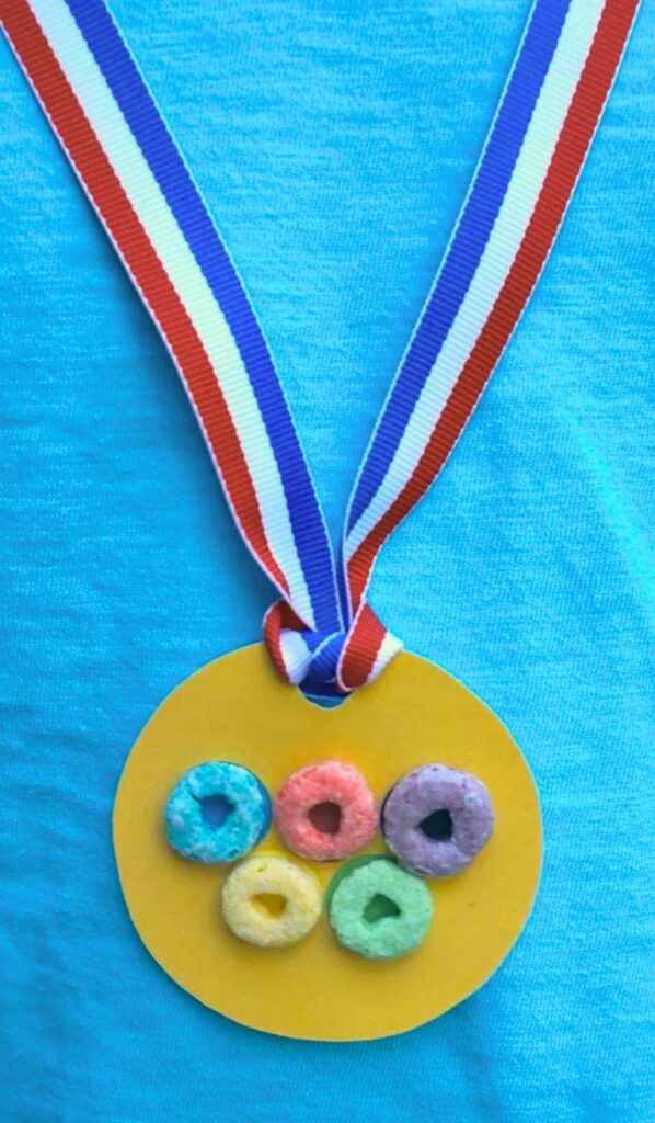 Olympic Activities for Kids: Gold medal Olympic rings necklace made with colorful cereal loops