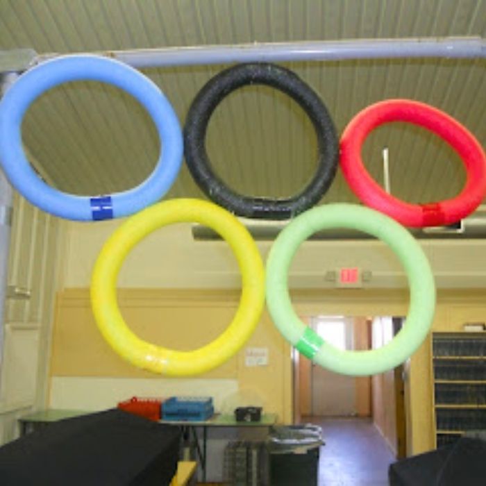Olympic Activities for Kids: Pool noodle Olympic ring game set up for kids to toss items