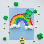 Coffee Filter Rainbow Leprechaun Craft for St. Patrick’s Day (+ Hat Template) with cotton ball clouds and colorful rainbow