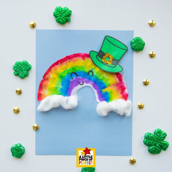 Coffee Filter Rainbow Leprechaun Craft for St. Patrick&rsquo;s Day (+ Hat Template) with cotton ball clouds and colorful rainbow