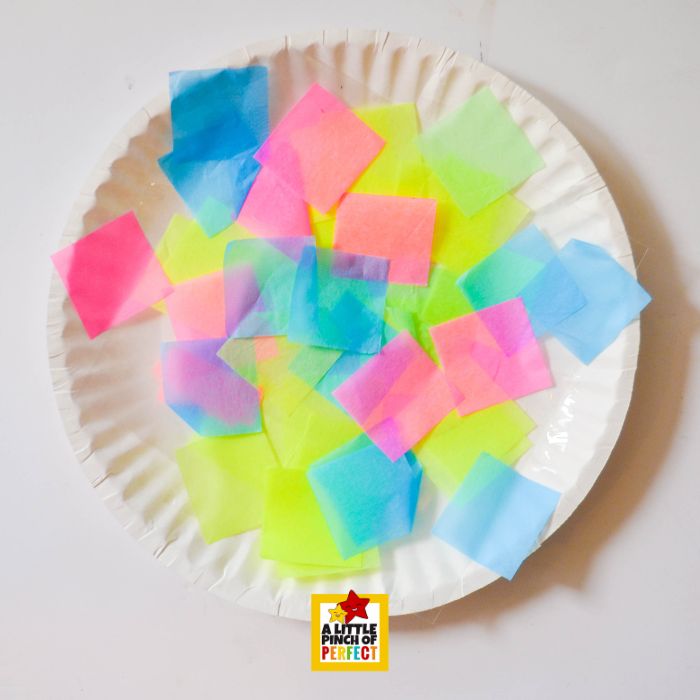 What’s Inside the Easter Egg? Easter Egg Suncatcher Craft for Kids (Free Template) – layering tissue paper pieces to fill egg shape with bright spring colors