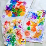 Puffy paint process art for kids with colorful abstract artwork showcasing texture, color mixing, and a fun 3D effect.