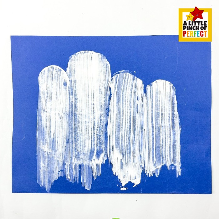 potato painted ghosts are such a fun way to explore process art with kids this Halloween season &mdash; white paint stamped onto blue paper using potato halves creates whimsical ghost columns perfect for a homeschool craft day or classroom activity.
