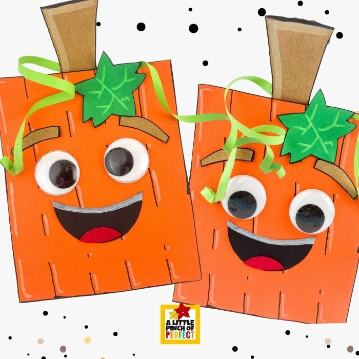 Pumpkin Paper Bag Craft with Template &mdash; the perfect finished fall craft for kids, showing a completed smiling paper bag pumpkin with googly eyes, curly green ribbon tendrils, a green leaf, and brown stem, inspired by Spookly the Square Pumpkin and ideal for Halloween homeschool projects or classroom parties.